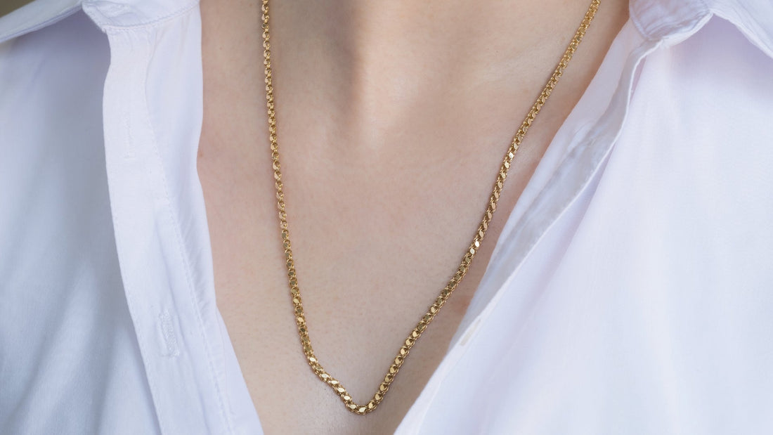 Elegant waterproof gold necklace worn by a woman, shining under natural Australian sunlight, perfect for everyday wear and outdoor activities